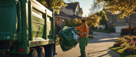 Worker loading debris into a truck during fast junk removal in a residential neighborhood