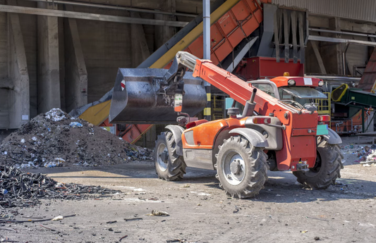 Construction junk removal using heavy equipment at renovation site
