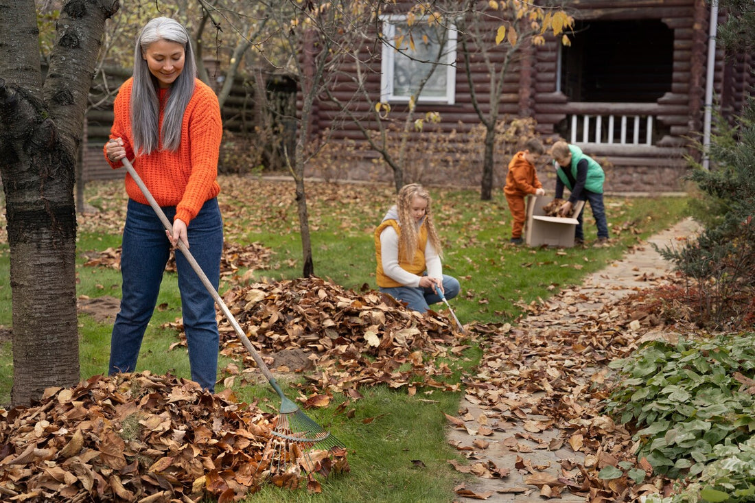 Family raking and clearing leaves in yard, Tallahassee home Junk Removal tips