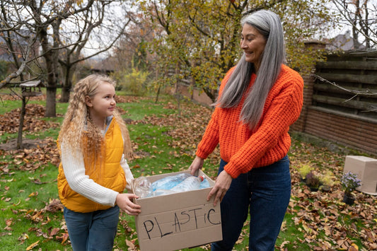 Mother and daughter collecting plastic for a junk removal business idea